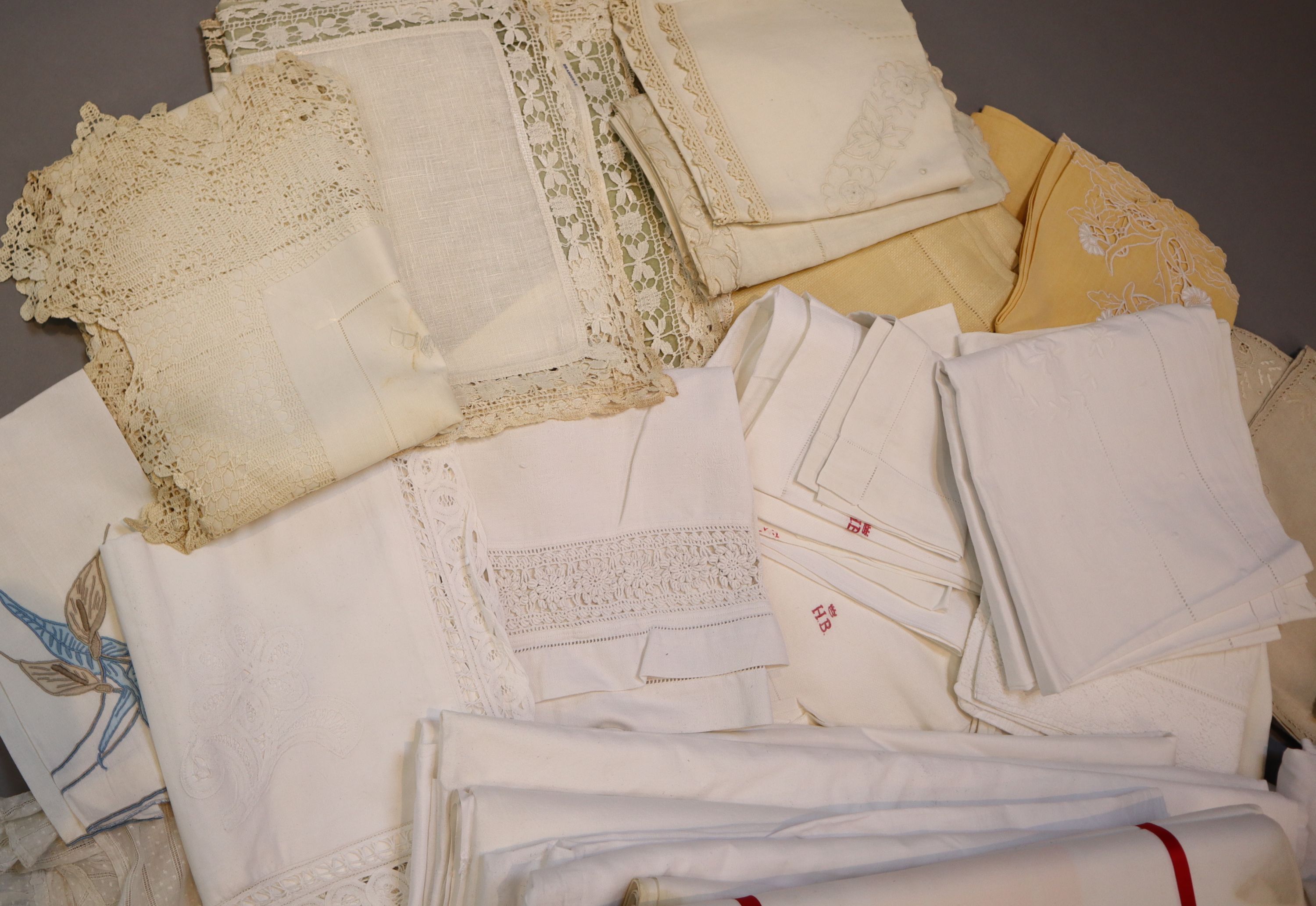 A quantity of linen sheets and embroidery